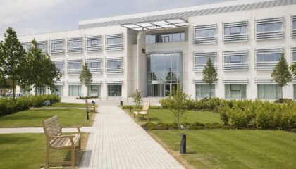 modern office building surrounded by green lawns