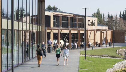 people walking towards cafe in Croxley Park, property managed by Workman LLP